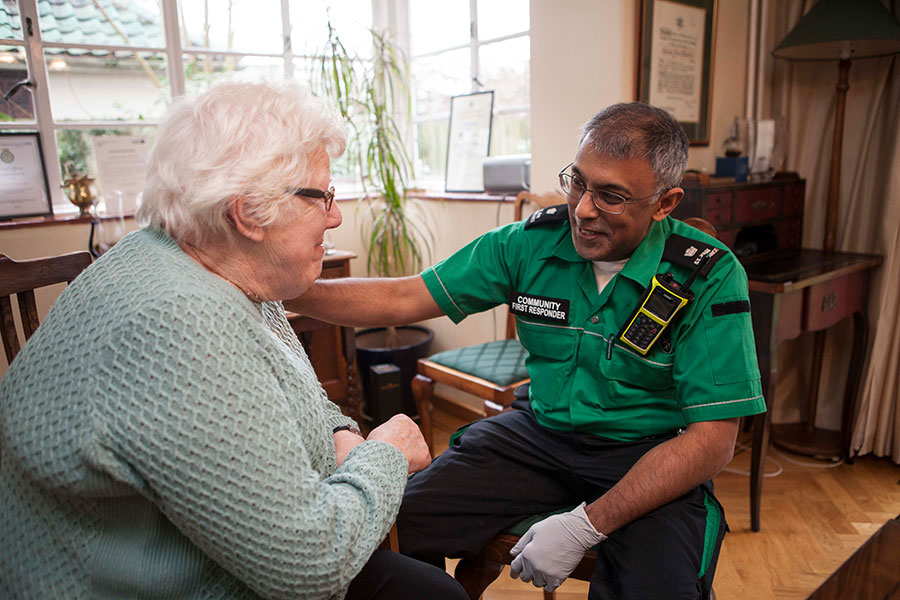 Community First Responder smiling at patient.